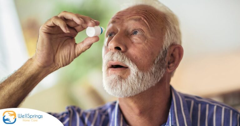 An older man uses eye drops as part of a good care routine to maintain his vision health.
